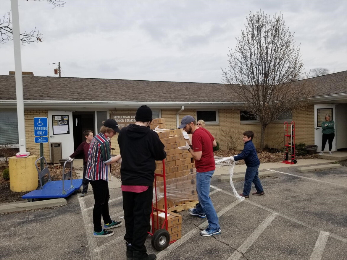 Volunteers assembling food boxes for area seniors earlier this month at Central Connections in Middletown